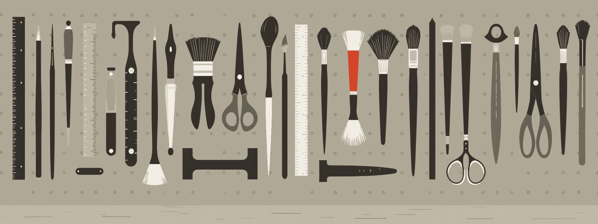 Brushes, rulers, scissors and other tools hung on a pegboard, one brush in red.